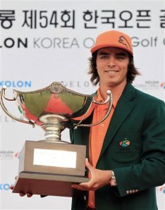 Rickie Fowler holds the trophy after winning the Korea Open in Cheonan, South Korea