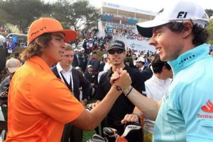 Rickie Fowler, left, of the United States is congratulated by Rory Mcllroy 
