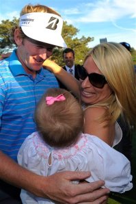 Brandt Snedeker celebrates with his wife Mandy and their 11-month-old daughter after winning the Farmers Insurance Open on the South Course at Torrey Pines on Jan. 29, 2012 in La Jolla, California.   (AP Photo/Scott A. Miller)
